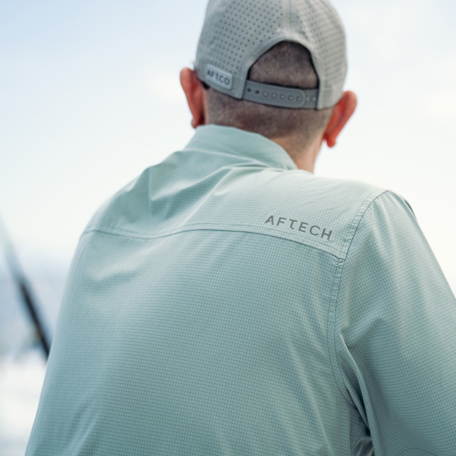 Gilet marine bi-matière ajusté avec poches zippées et à manches longues